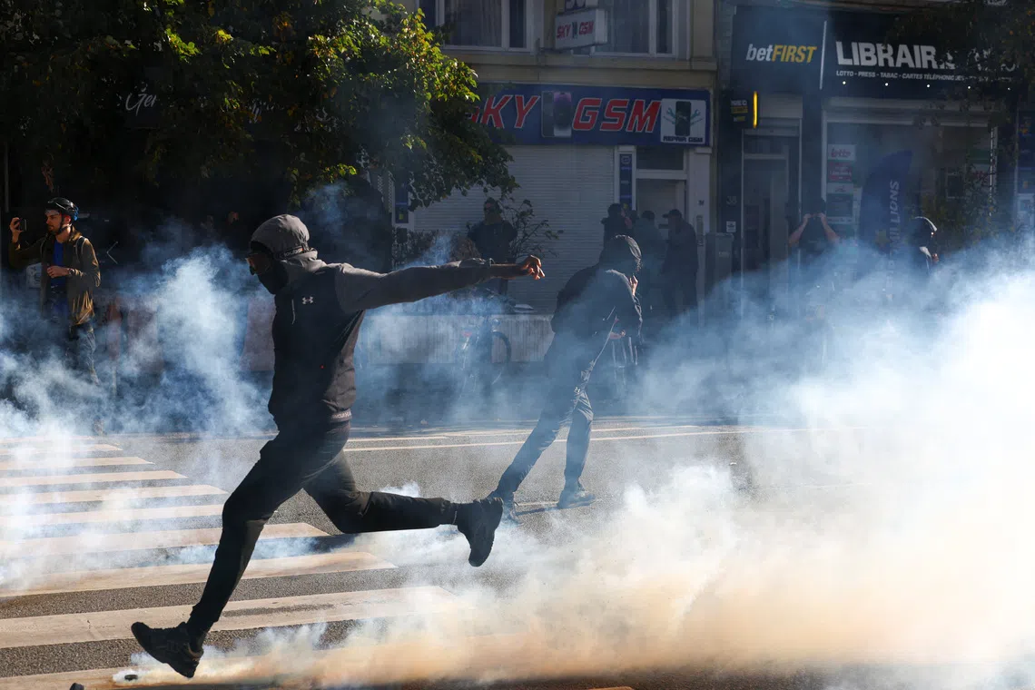 A demonstrator during a student protest in Brussels, Belgium, on Oct 17.