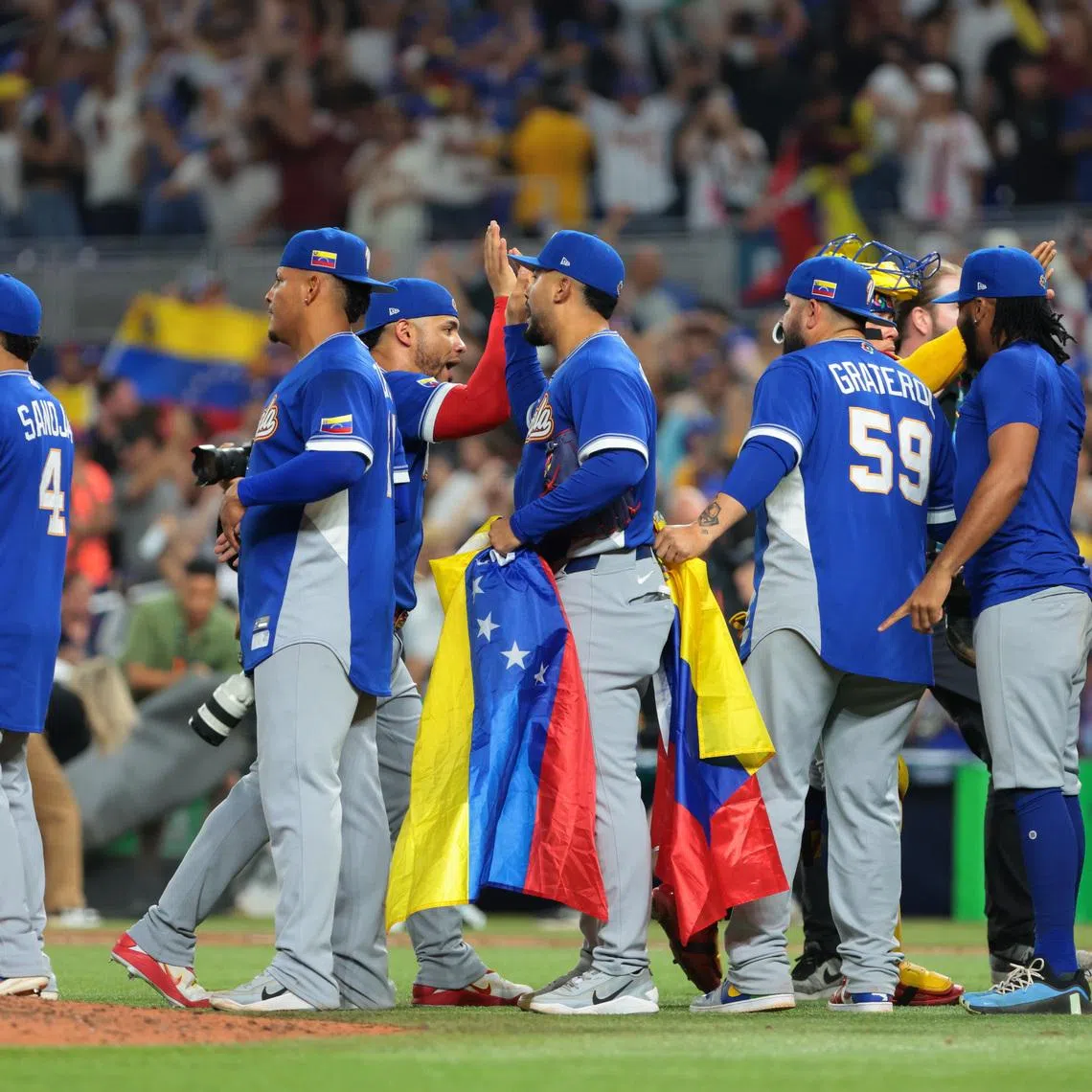 Mar 16, 2026; Miami, FL, United States; Team Venezuela celebrates after defeating Italy in a semifinal game of the 2026 World Baseball Classic at loanDepot Park. Mandatory Credit: Sam Navarro-Imagn Images