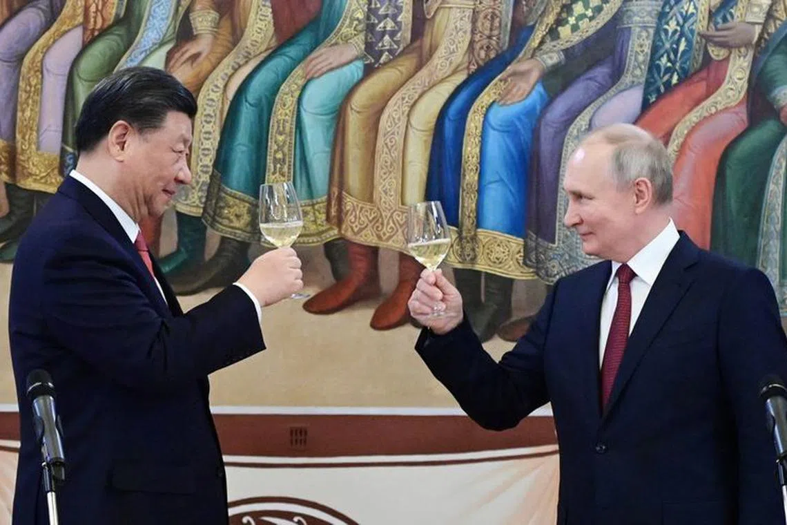 FILE PHOTO: Russian President Vladimir Putin and Chinese President Xi Jinping attend a reception at the Kremlin in Moscow, Russia March 21, 2023. Sputnik/Pavel Byrkin/Kremlin via REUTERS/File photo