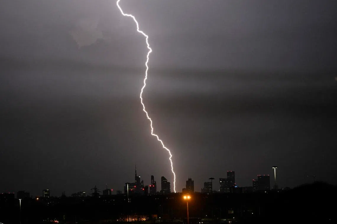 Lightning strikes during a thunderstorm with heavy rain and brief hail over Milan, Italy, on May 28, 2026.