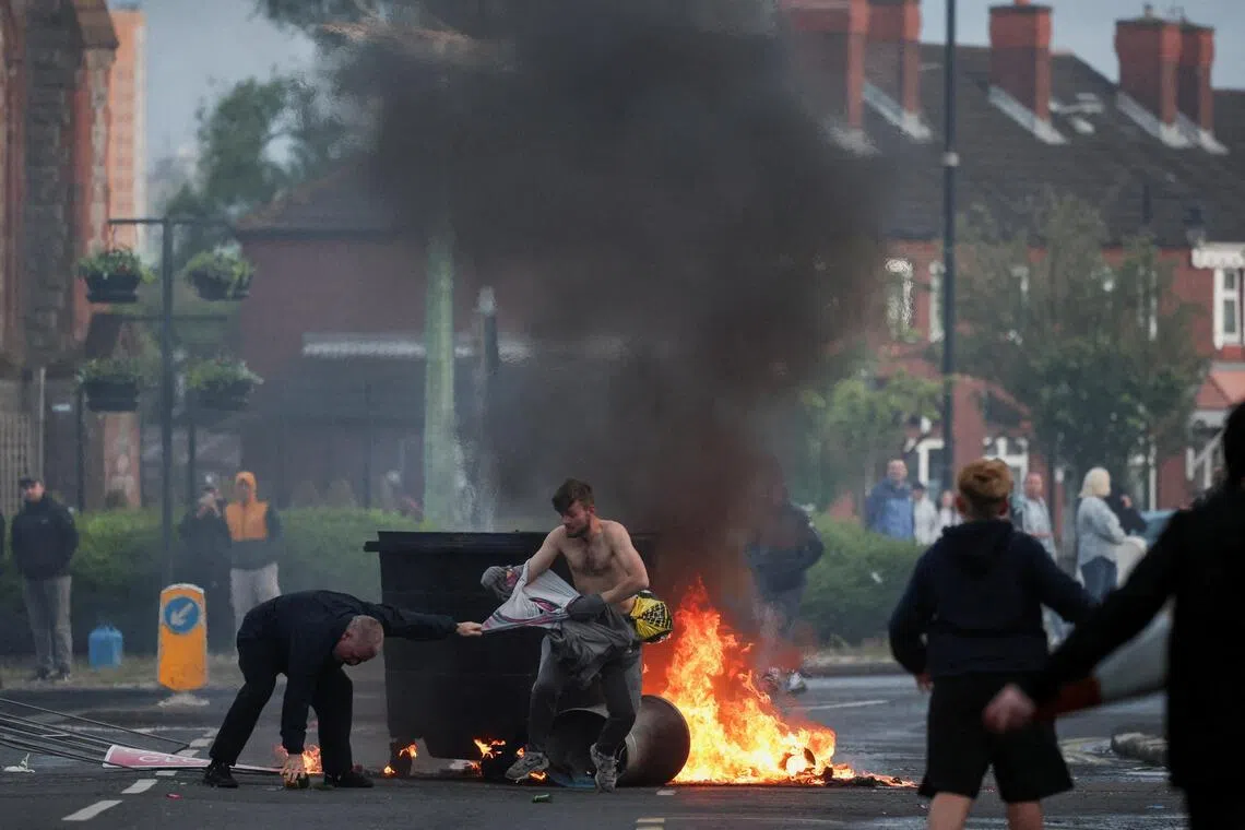 Newly minted trillionaire Musk under fire over Belfast riots