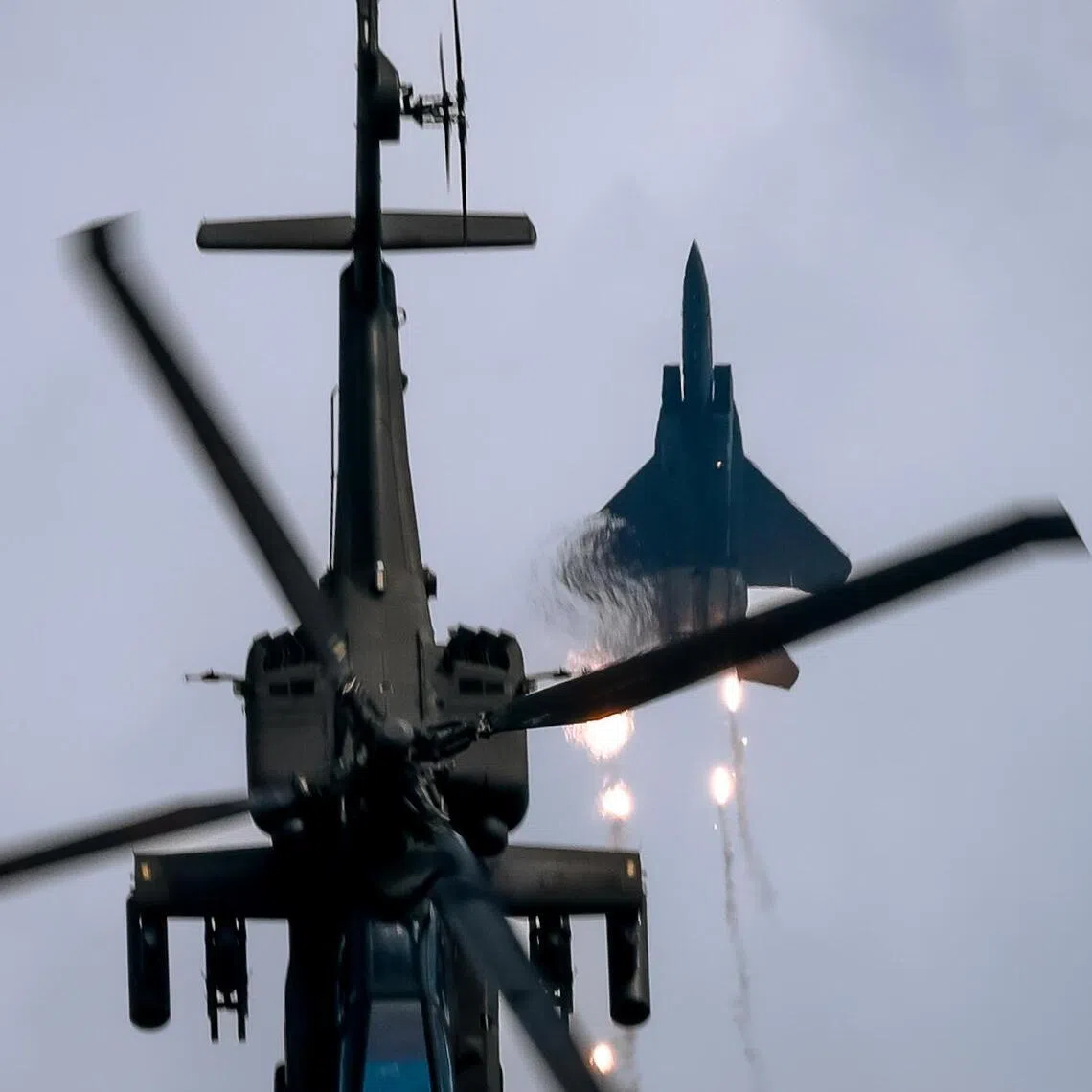 Republic of Singapore Air Force	perform in their F-15SG & AH-64D during an aerial display at the Singapore Airshow held at Changi Exhibition Centre, Feb 25, 2024.