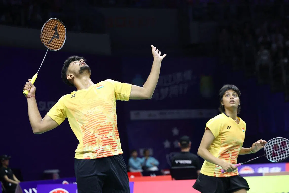 India's Sai Pratheek K. hits a return beside mixed doubles partner Tanisha Crasto in the 4-1 Sudirman Cup loss to Chinese Taipei in Suzhou on May 14, 2023.