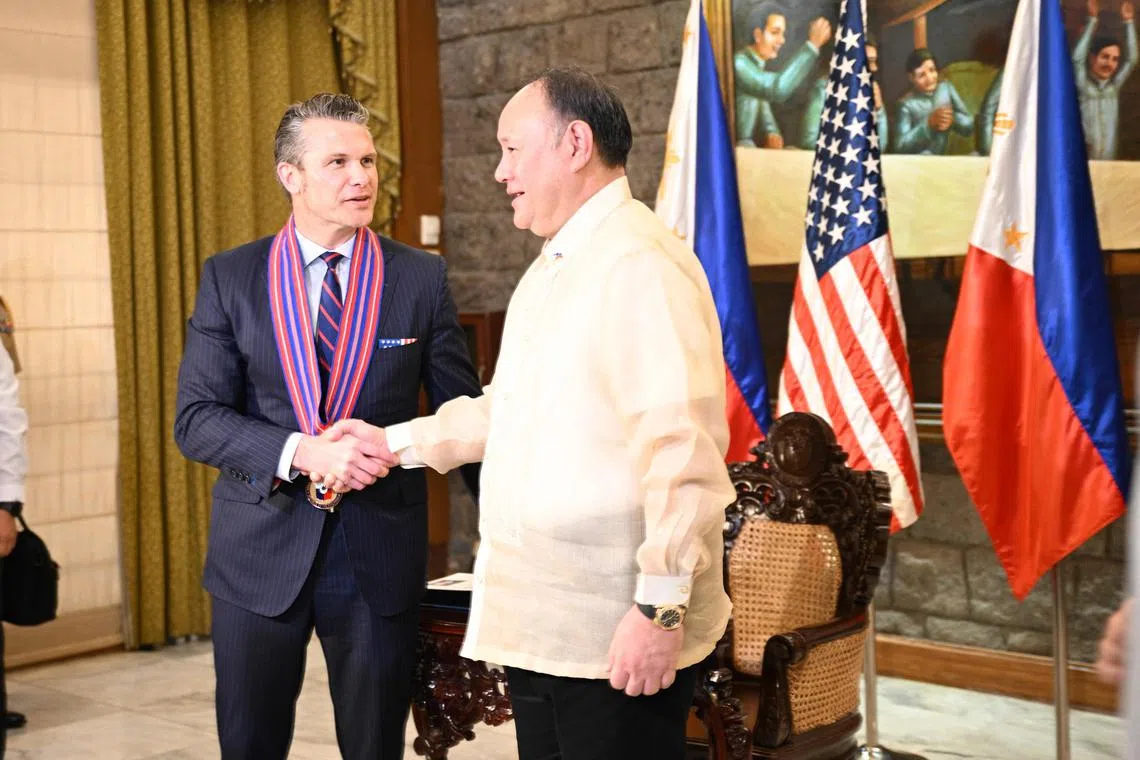 US Defence Secretary Pete Hegseth (left) with his Filipino counterpart, Mr Gilberto Teodoro Jr, in Manila on March 28. 