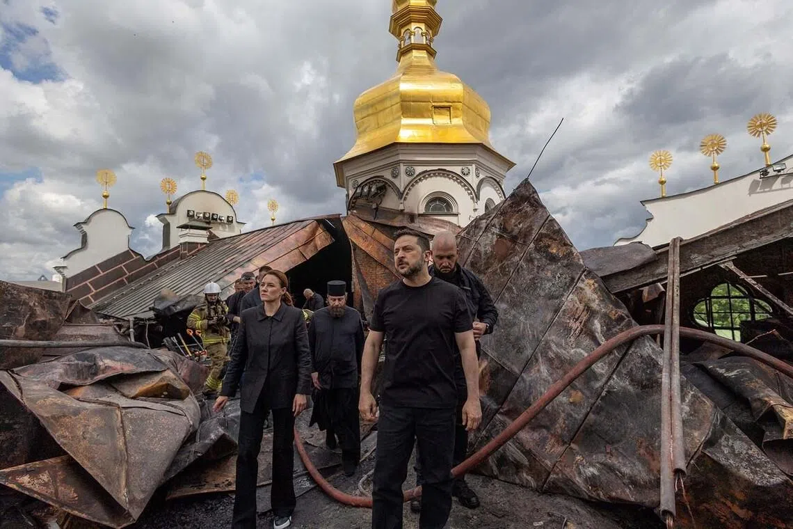 Ukraine's President Volodymyr Zelenskiy and Ukrainian Prime Minister Yulia Svyrydenko visiting the Dormition Cathedral of the Kyiv Pechersk Lavra, which was hit during Russian missile and drone strikes, amid Russia's attack on Ukraine, in Kyiv, Ukraine June 15.