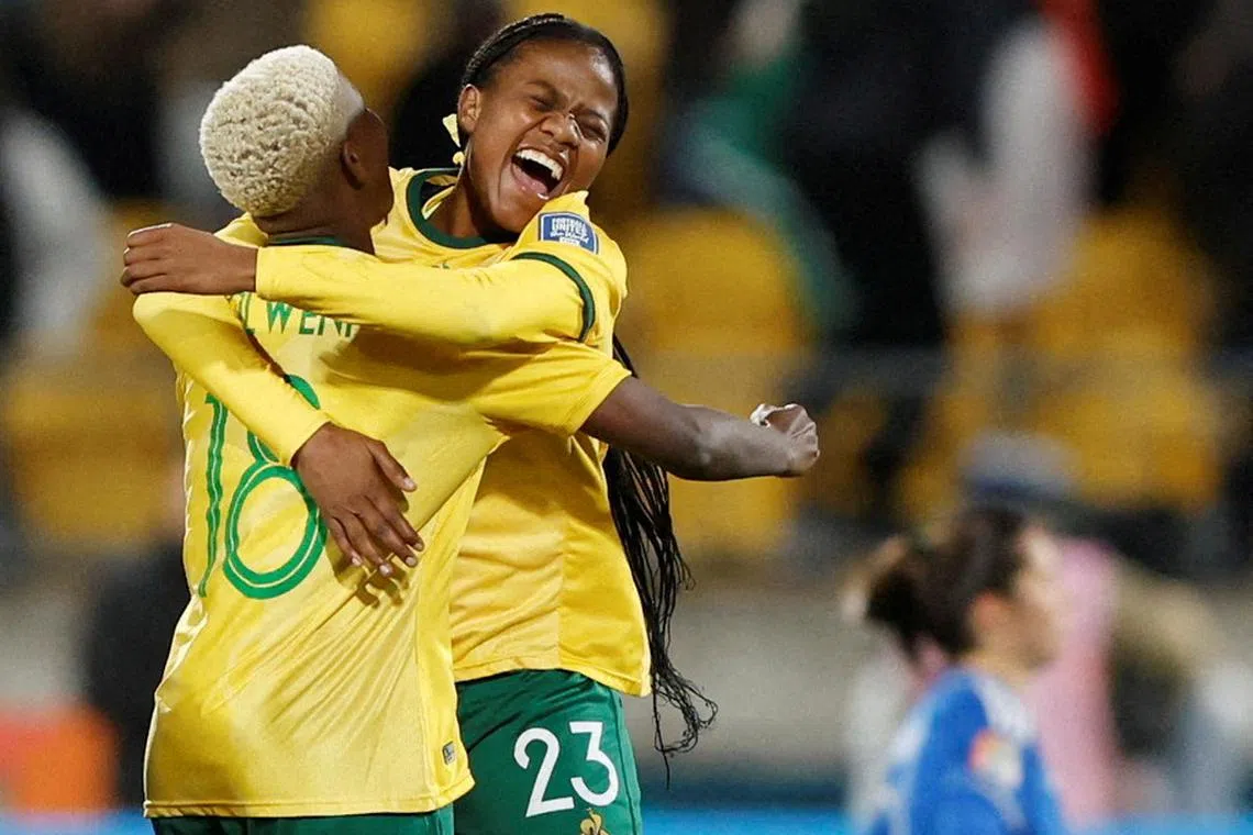 South Africa's Wendy Shongwe celebrates with Sibulele Holweni after the match as the team qualify for the knockout stages.