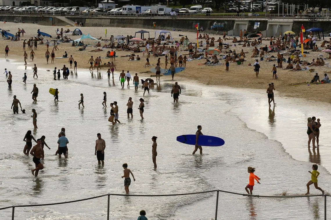 FILE PHOTO: People on Bondi Beach, Sydney, Australia, March 6, 2023. REUTERS/Jaimi Joy/File Photo