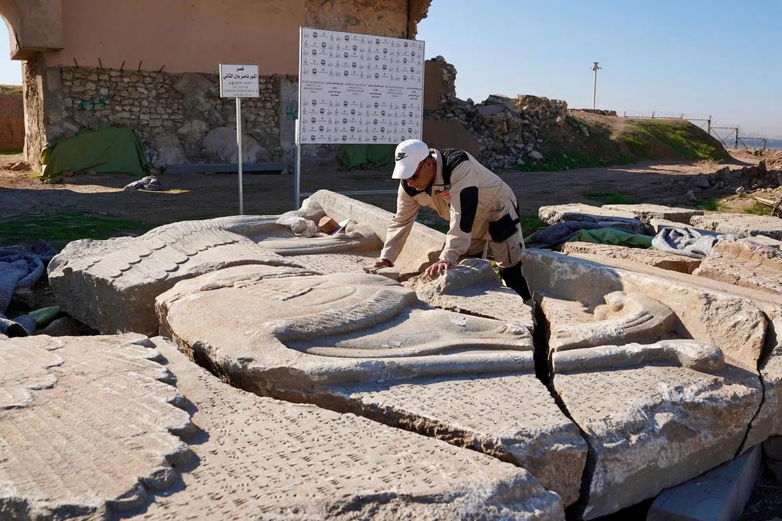An archaeology expert catalogues destroyed archaeological artefacts at the archaeological site of Nimrud, south of Mosul on Jan 3, 2025. 