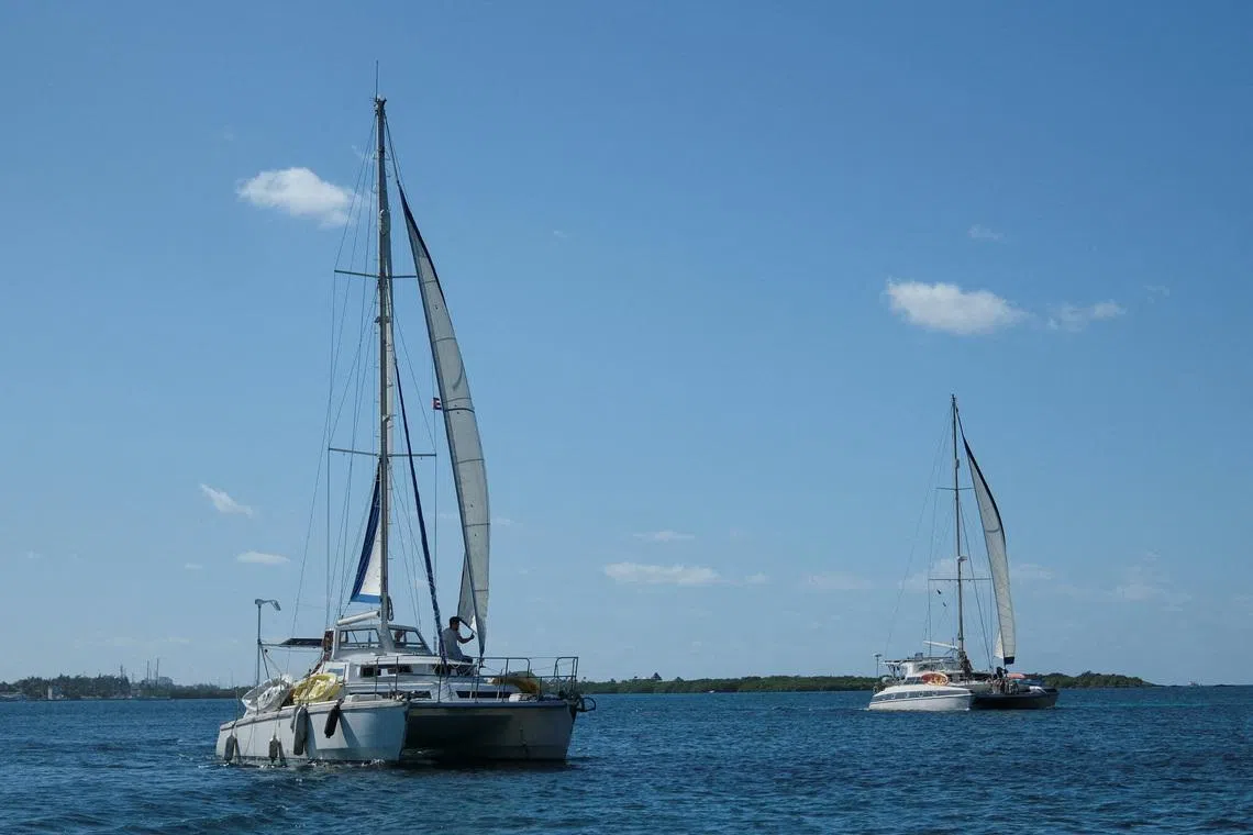 FILE PHOTO: The sailboats Friendship and Tigger Moth, carrying humanitarian aid for Cuba and crewed by activists taking part in the Nuestra America Convoy flotilla, depart Isla Mujeres, Quintana Roo state, Mexico, March 21, 2026. REUTERS/Paola Chiomante/File Photo