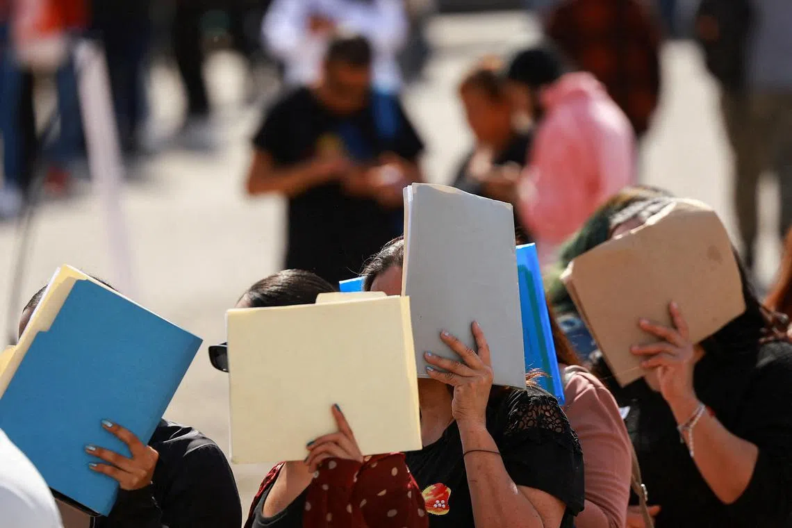 People lining up to apply for jobs at a job fair organized by the Mexican government, as experts warn of a possible economic recession, in Ciudad Juarez, Mexico, on March 26, 2025.
