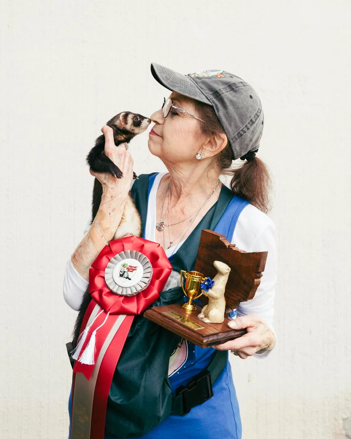Mary Cruse holds her ferret Hammie at the Ferret Buckeye Bash in Columbus, Ohio. Hammie took home the Best in Show award.