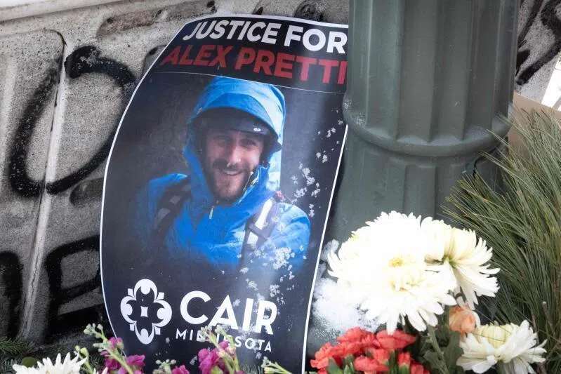 A picture sits at a memorial to Mr Alex Pretti, an ICU nurse who was shot and killed by federal agents, in Minneapolis, Minnesota. 