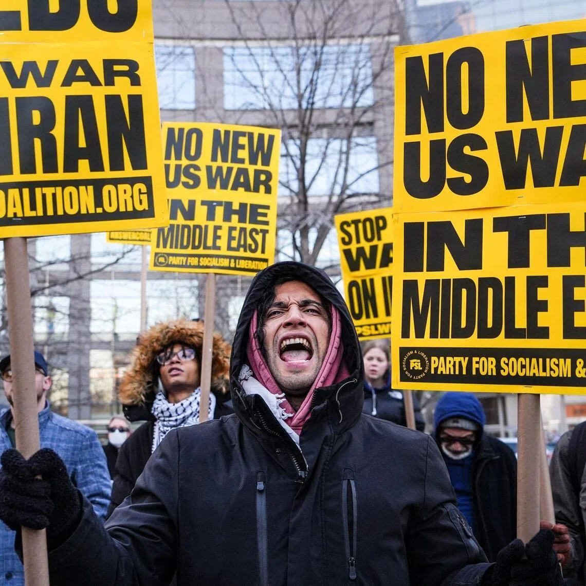 A person holds placards and chants slogans as they rally during a protest against US military action in Iran in New York City, on March 2, 2026. The United States hit hundreds of targets across Iran, and Israel expanded its bombing to Lebanon on March 2 as President Donald Trump vowed to avenge the first US deaths in the war he launched to topple Tehran's ruling clerics. Iranian forces fired missiles and drones across the Middle East, killing people in Israel and the United Arab Emirates, in retaliation for the conflict that began February 28 with the death of Iran's supreme leader, Ayatollah Ali Khamenei. (Photo by Ryan MURPHY / AFP)