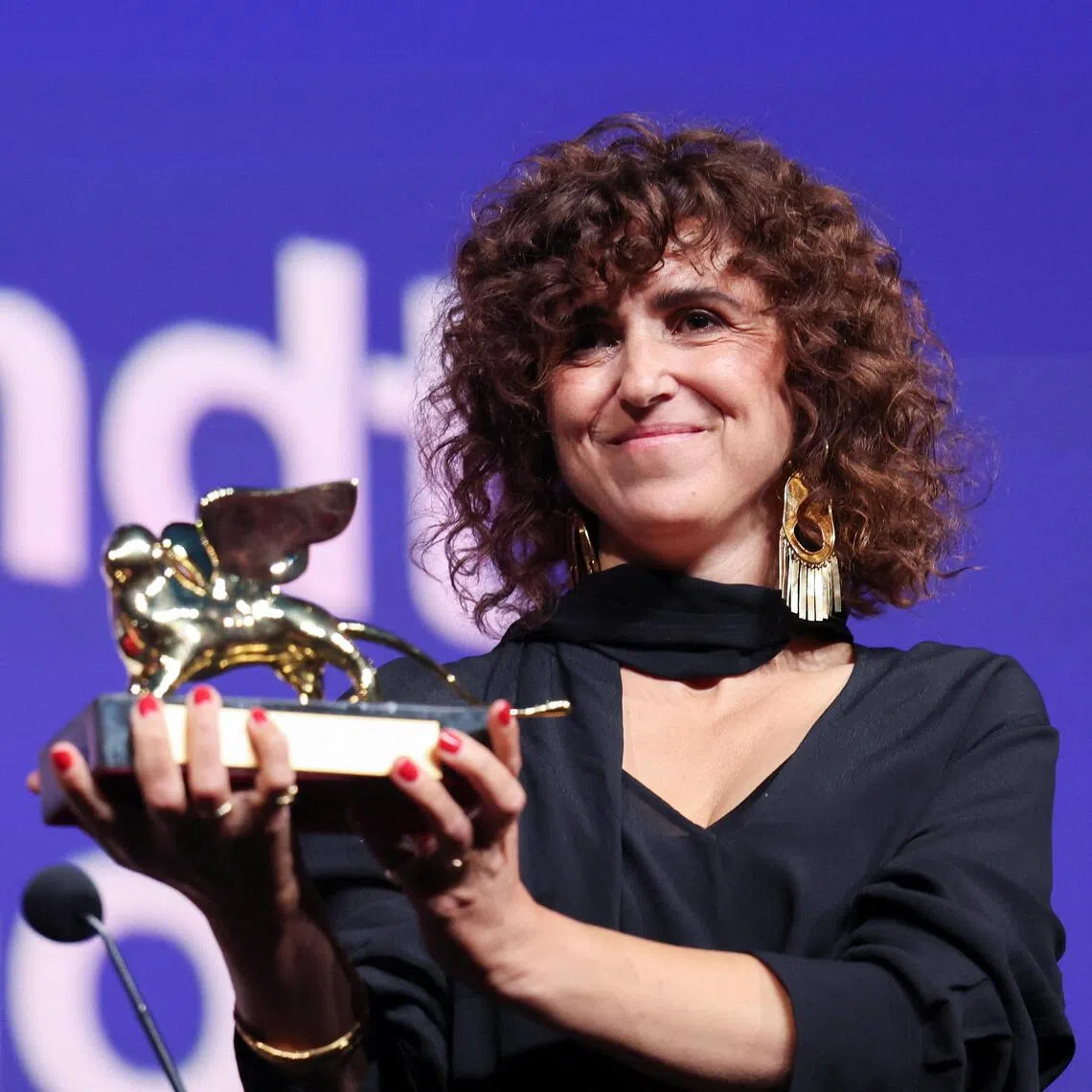 Filmmaker May el-Toukhy receiving the Golden Lion Award at the Venice film festival on Sept 12 for her movie, Woman Unknown.