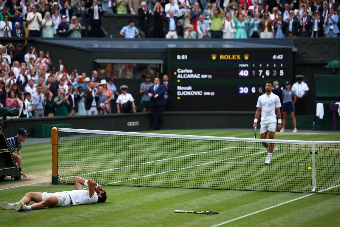 Spain's Carlos Alcaraz celebrating after winning his final match against Novak Djokovic at Wimbledon.