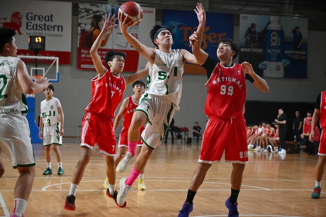 St Joseph’s Institution’s Houston Cheng was hard to miss with his black headband and pink socks as he scored 37 points to help his team beat National Junior College 74-48 in the C Division boys’ basketball League 1 final.