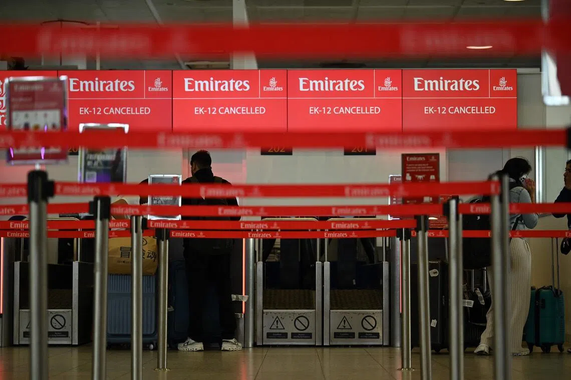 A check-in desk shows information on a cancelled flight at the London Gatwick Airport on Feb 28, 2026.
