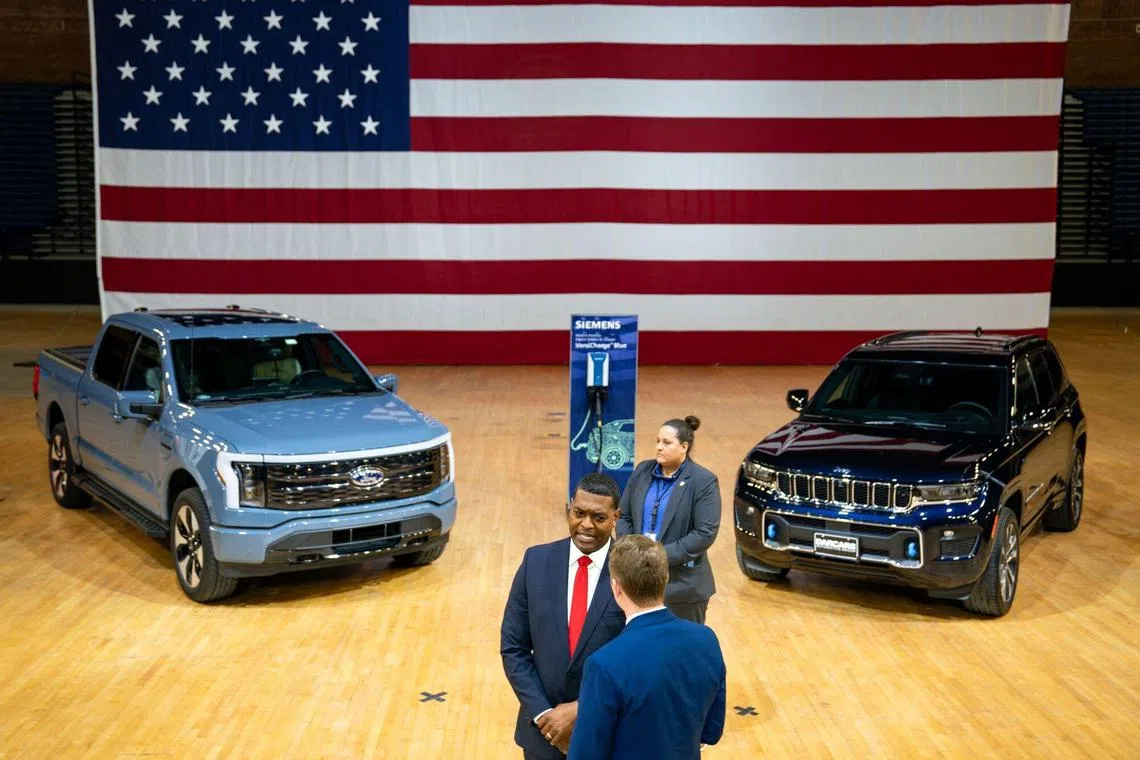 Michael Regan, administrator of the US Environmental Protection Agency (EPA), bottom center left, following an event at the DC Armory in Washington, DC, US, on Wednesday, March 20, 2024. The Biden administration moved Wednesday to throttle pollution from the nation's cars and light trucks, imposing tailpipe emission limits so stringent they will compel automakers to rapidly boost sales of battery electric and plug-in hybrid models. Photographer: Kent Nishimura/Bloomberg