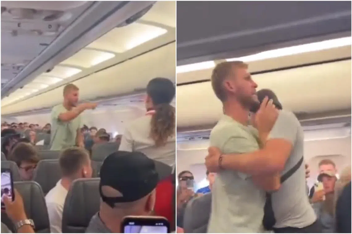 In a video, the man is seen forcing his way down the aisle before two other passengers tackled him to the ground.