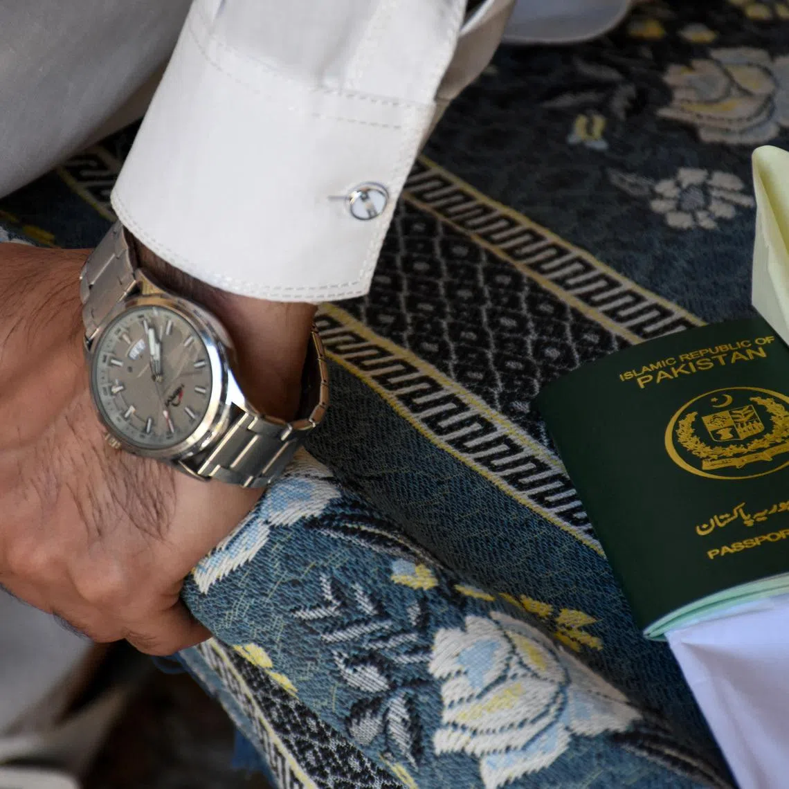 A Pakistani Shi'ite Muslim man, who was working as a building security officer in the United Arab Emirates, speaks with Reuters at his village, after being deported along with many others following the U.S.-Israeli war against Iran, in Chakwal, Pakistan May 5, 2026. REUTERS/Waseem Khan