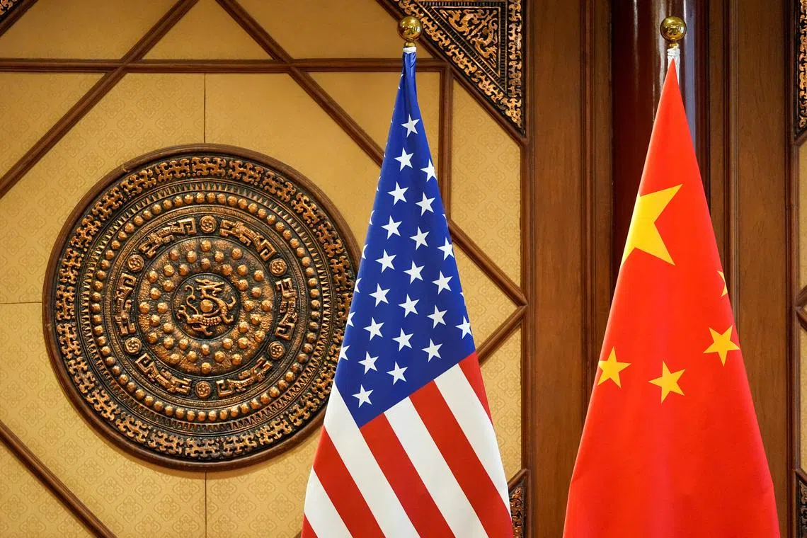 FILE PHOTO: Flags of the U.S. and China sit in a room where U.S. Secretary of State Antony Blinken meets with China's Minister of Public Security Wang Xiaohong at the Diaoyutai State Guesthouse, April 26, 2024, in Beijing, China.     Mark Schiefelbein/Pool via REUTERS/File Photo