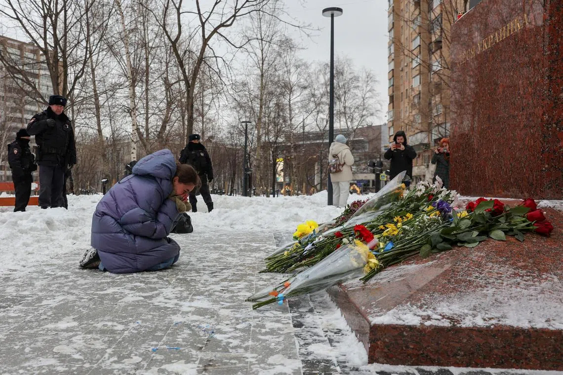 In Moscow, at least three people laying flowers on a monument to prominent Ukrainian poet Lesya Ukrainka were quickly detained by police officers.