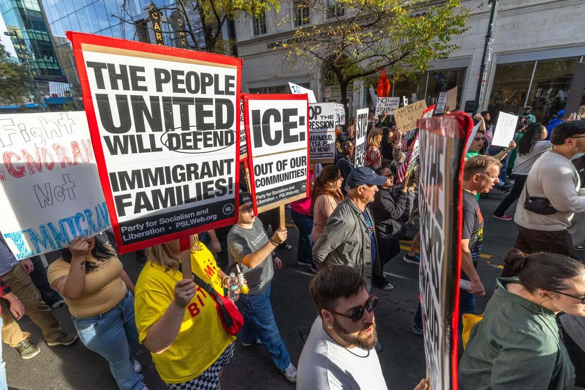 Protesters march through uptown for the "No Border Patrol In Charlotte" rally on Nov 15, 2025 in Charlotte, North Carolina. 