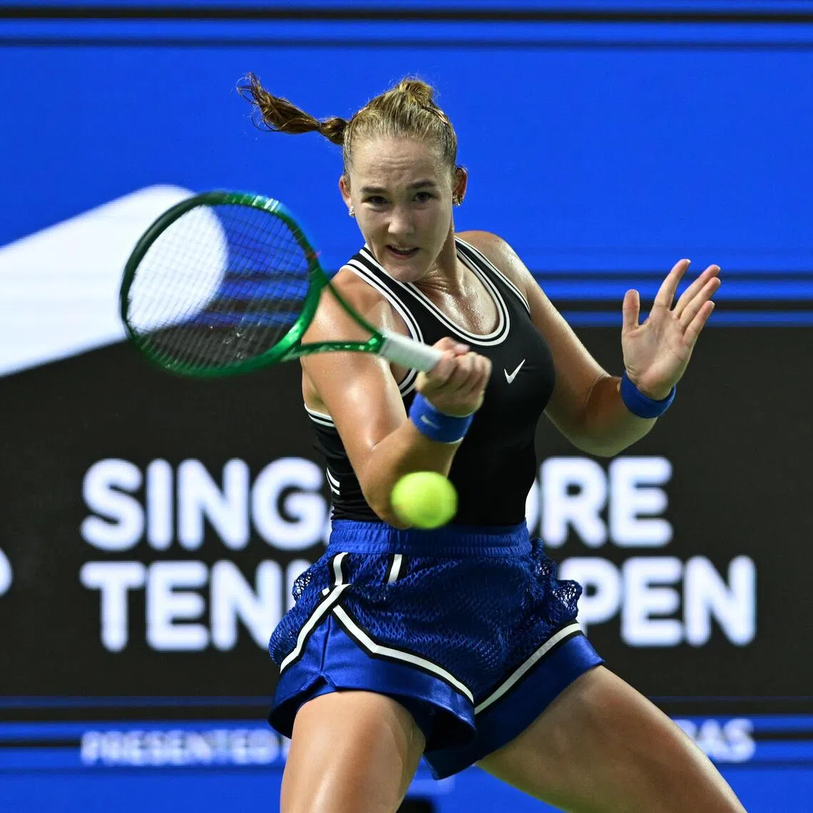 Mirra Andreeva from Russia returning a shot to Aliaksandra Sasnovich from Belarus at the WTA 500 Singapore Tennis Open on Sept 23.