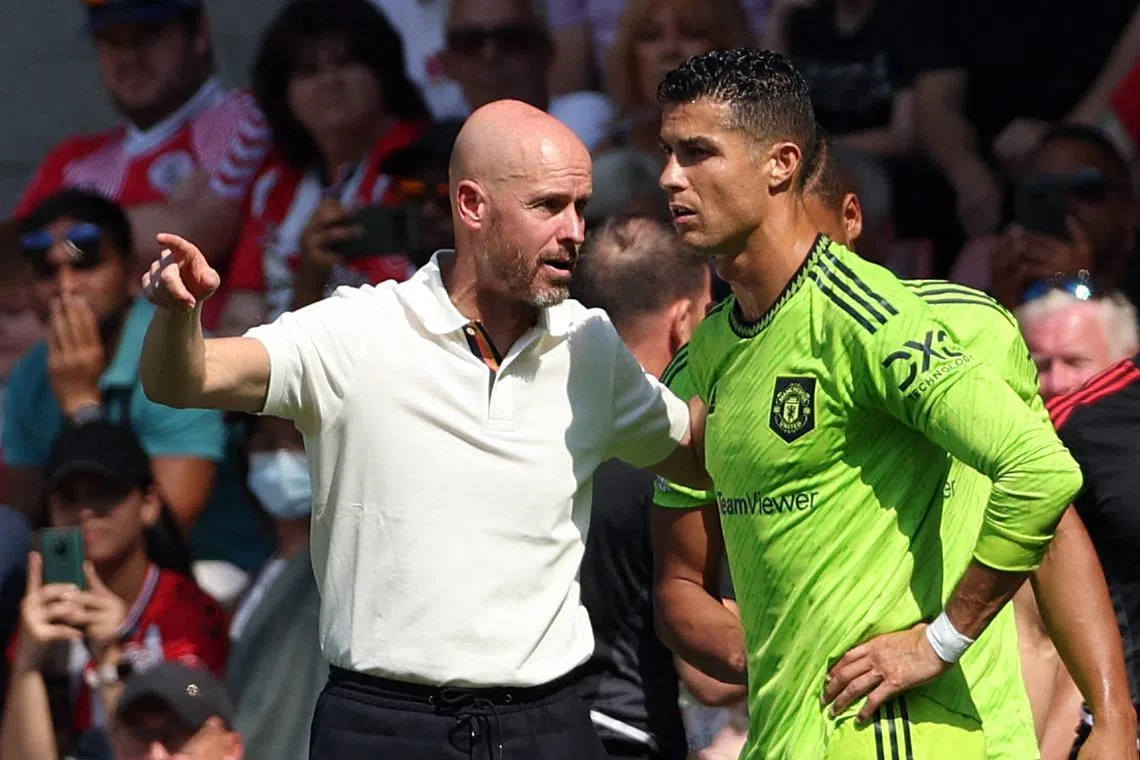 Manchester United manager Erik ten Hag instructing substitute Cristiano Ronaldo during the English Premier League match between Southampton and Manchester United at St Mary's Stadium.