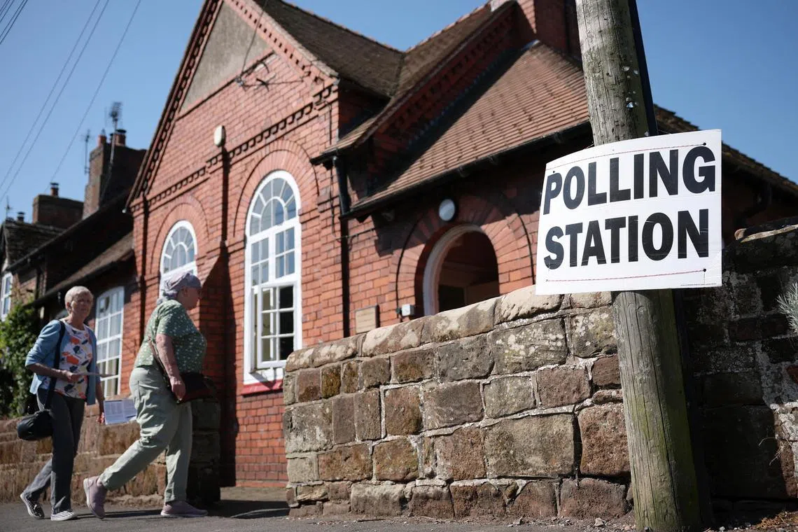 People enter a polling station as voting gets underway in the Runcorn and Helsby parliamentary by-election in Frodsham, Britain, May 1, 2025. REUTERS/Phil Noble     TPX IMAGES OF THE DAY     