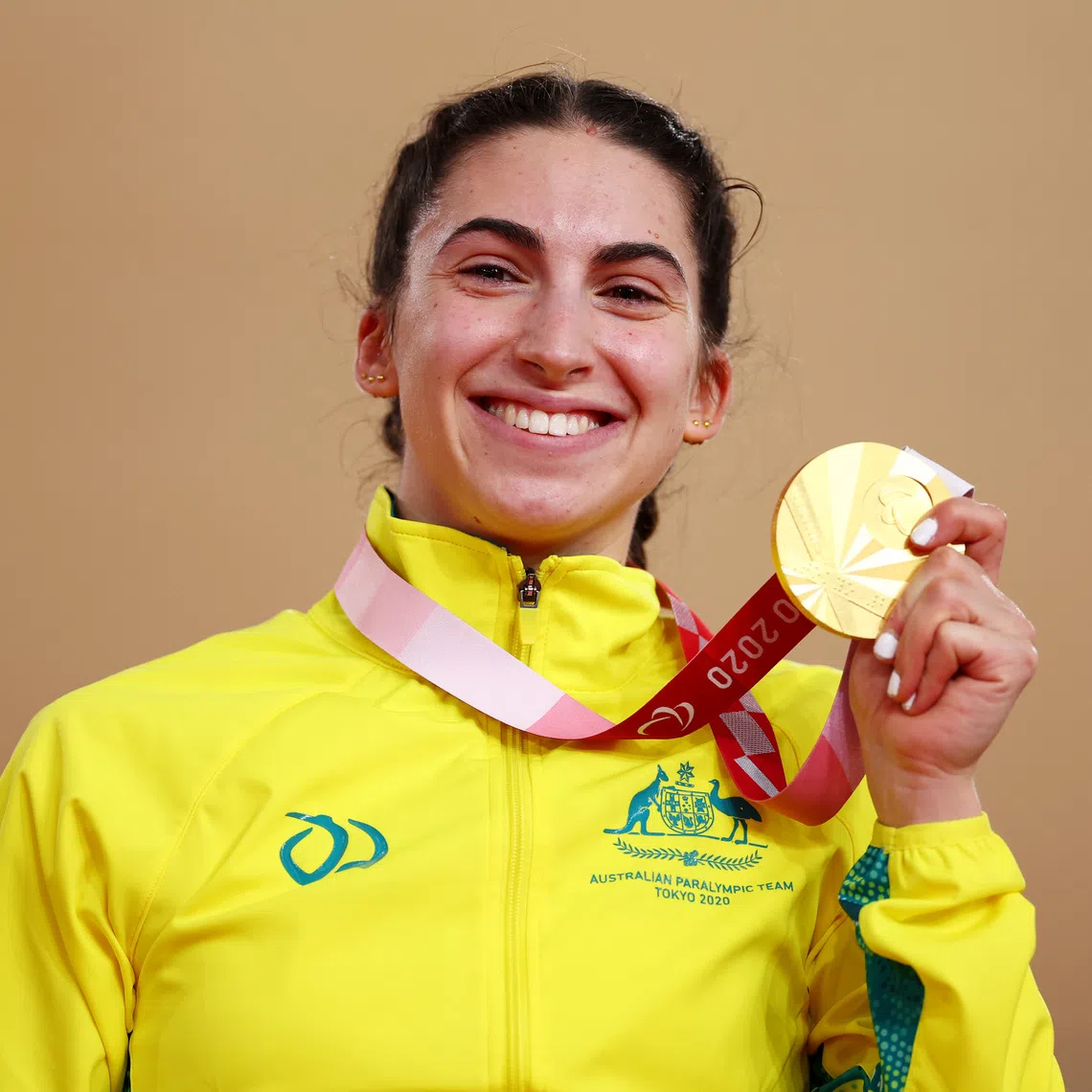 Tokyo 2020 Paralympic Games - Cycling Track - Women's C1-3 3000m Individual Pursuit - Medal Ceremony - Izu Velodrome, Shizuoka, Japan - August 25, 2021. Gold Medallist Paige Greco of Australia celebrates REUTERS/Thomas Peter