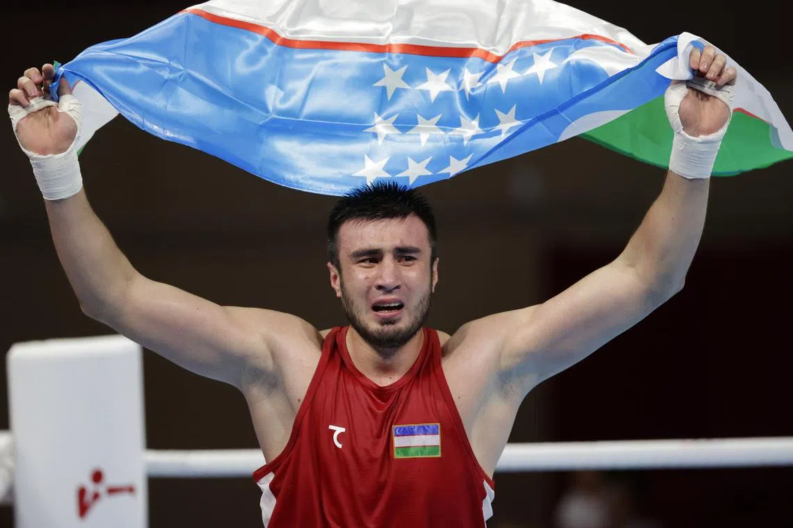 FILE PHOTO: Tokyo 2020 Olympics - Boxing - Men's Super Heavyweight - Final - Kokugikan Arena - Tokyo, Japan - August 8, 2021. Bakhodir Jalolov of Uzbekistan celebrates his win against Richard Torrez of the United States REUTERS/Ueslei Marcelino/File Photo