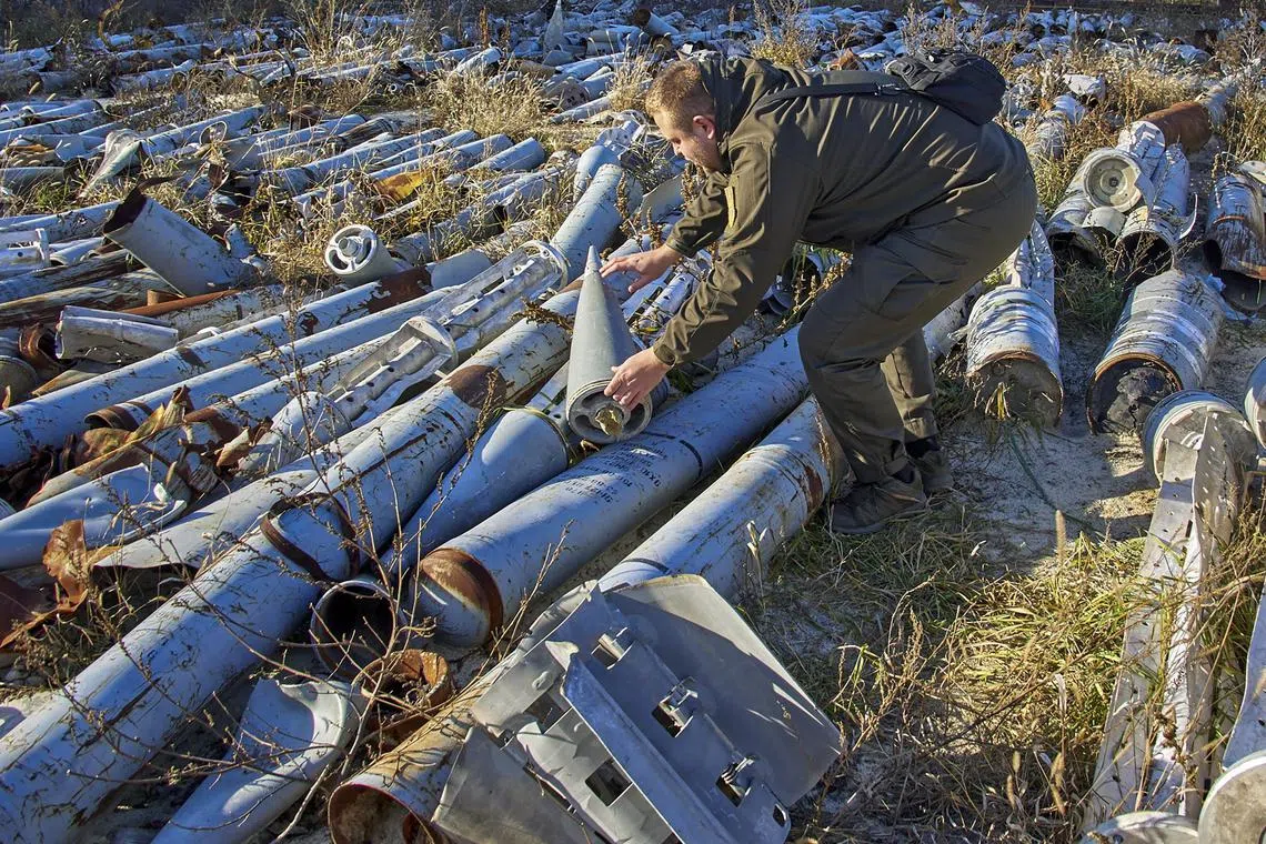 Missile remains are collected in Kharkiv, Ukraine, as evidence of Russian shelling against civilian targets, on Nov 29, 2022.