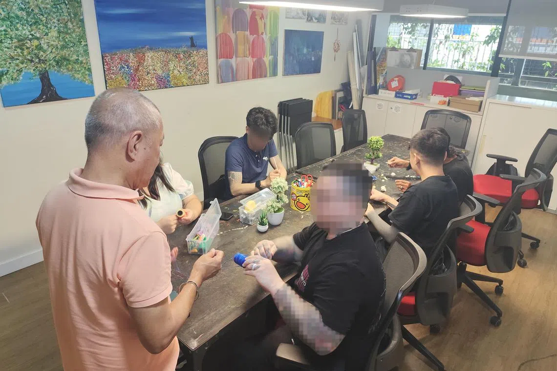 A professional artist conducts weekly art classes at We Care's drop-in centre as part of the support given for people trying to overcome addiction.