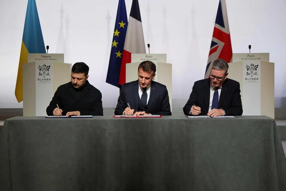 (From left) Ukrainian President Volodymyr Zelensky, French President Emmanuel Macron and British Prime Minister Keir Starmer signing a declaration of intent outlining the deployment of forces for Ukraine in the event that a peace deal is reached.