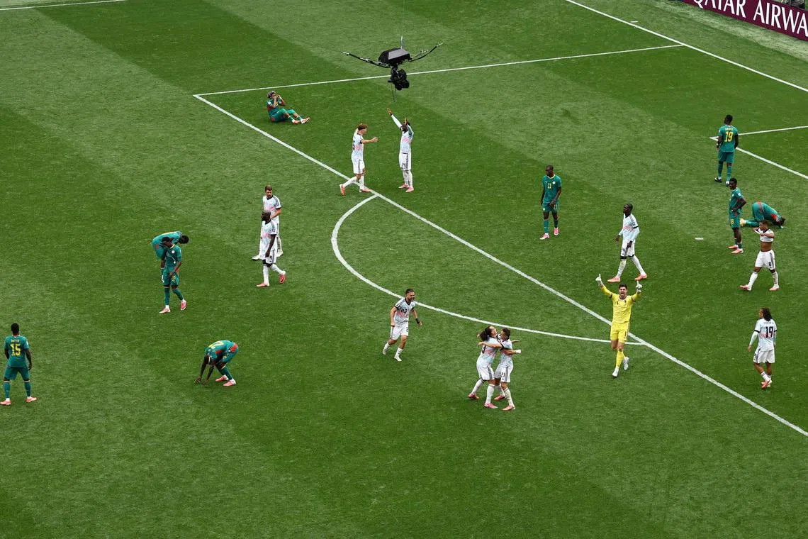 Belgium players celebrate after an extra-time victory over Senegal.