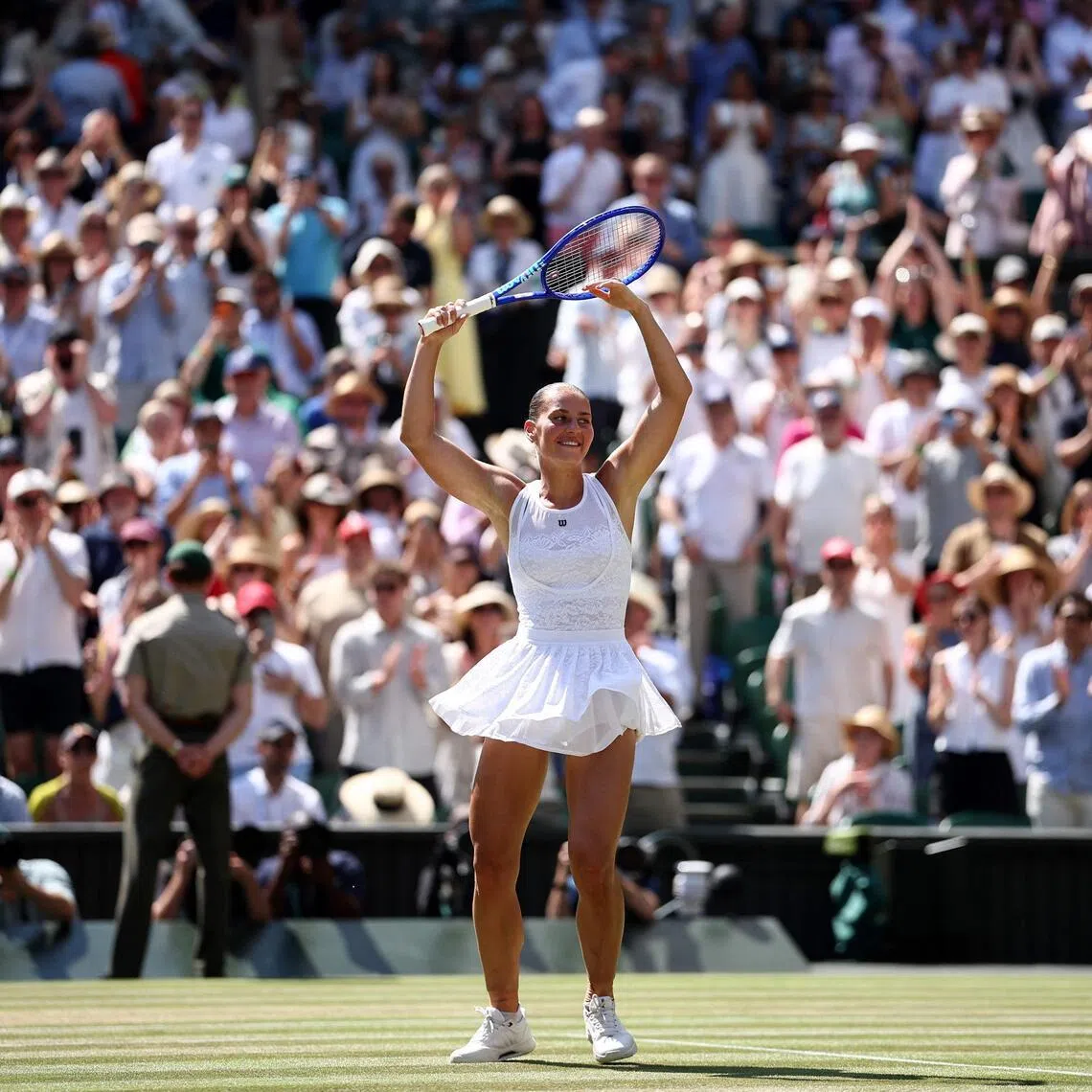 Ukraine’s Marta Kostyuk celebrates after beating Italy’s Jasmine Paolini in the Wimbledon quarter-finals on July 8.