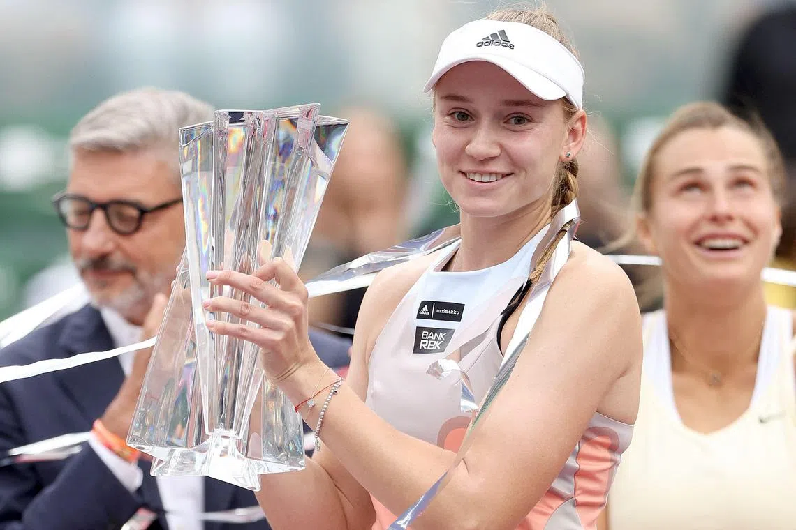 Elena Rybakina of Kazakhstan posing with the winner's trophy after defeating Aryna Sabalenka of Belarus during the BNP Paribas Open at Indian Wells.