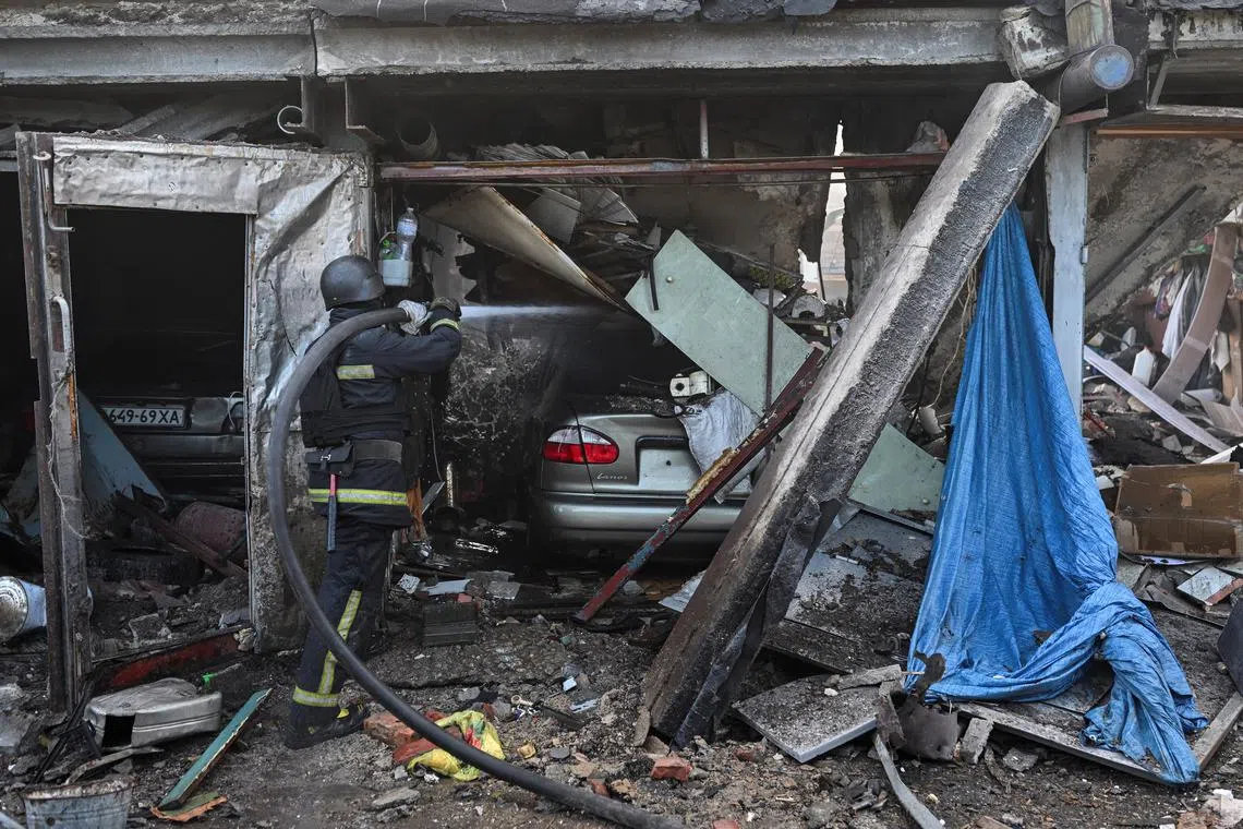 A rescue member works at a site of a Russian air strike, amid Russia's attack on Ukraine, in Kharkiv, Ukraine June 10, 2024. REUTERS/Viacheslav Ratynskyi/ File Photo