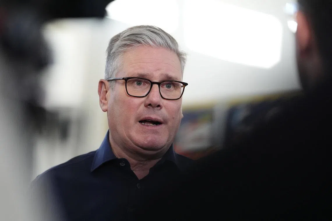 Britain's Prime Minister Keir Starmer speaks in an interview with a broadcaster during a visit to the Emmer Green Youth & Community Centre, to mark the beginning of the year and highlight the government's decision to freeze rail fares, in Reading, Berkshire, Britain January 5, 2026.    Jonathan Brady/Pool via REUTERS