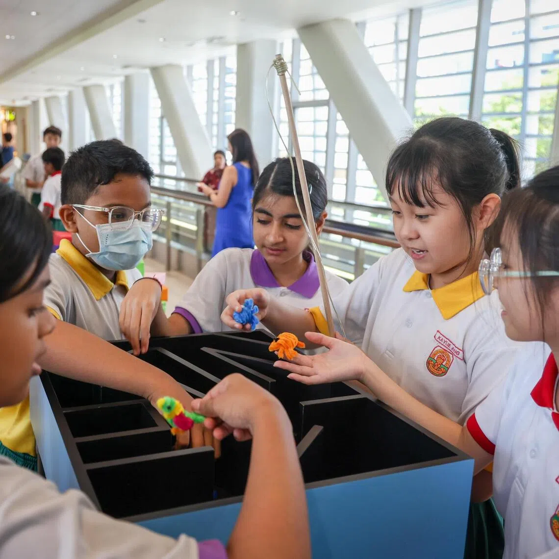 ST20250918_202577000676/gcrehab/Gabrielle Chan/Jason Quah
Princess Elizabeth Primary School student Kaylie Ang (2R) with a game she designed to aid patients' recovery, pictured with her schoolmates on Sep 18, 2025. ST PHOTO: JASON QUAH