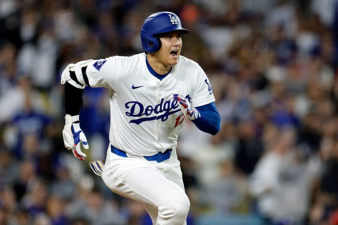 Shohei Ohtani #17 of the Los Angeles Dodgers hits a one run base hit during the seventh inning at Dodger Stadium on Sept 26.