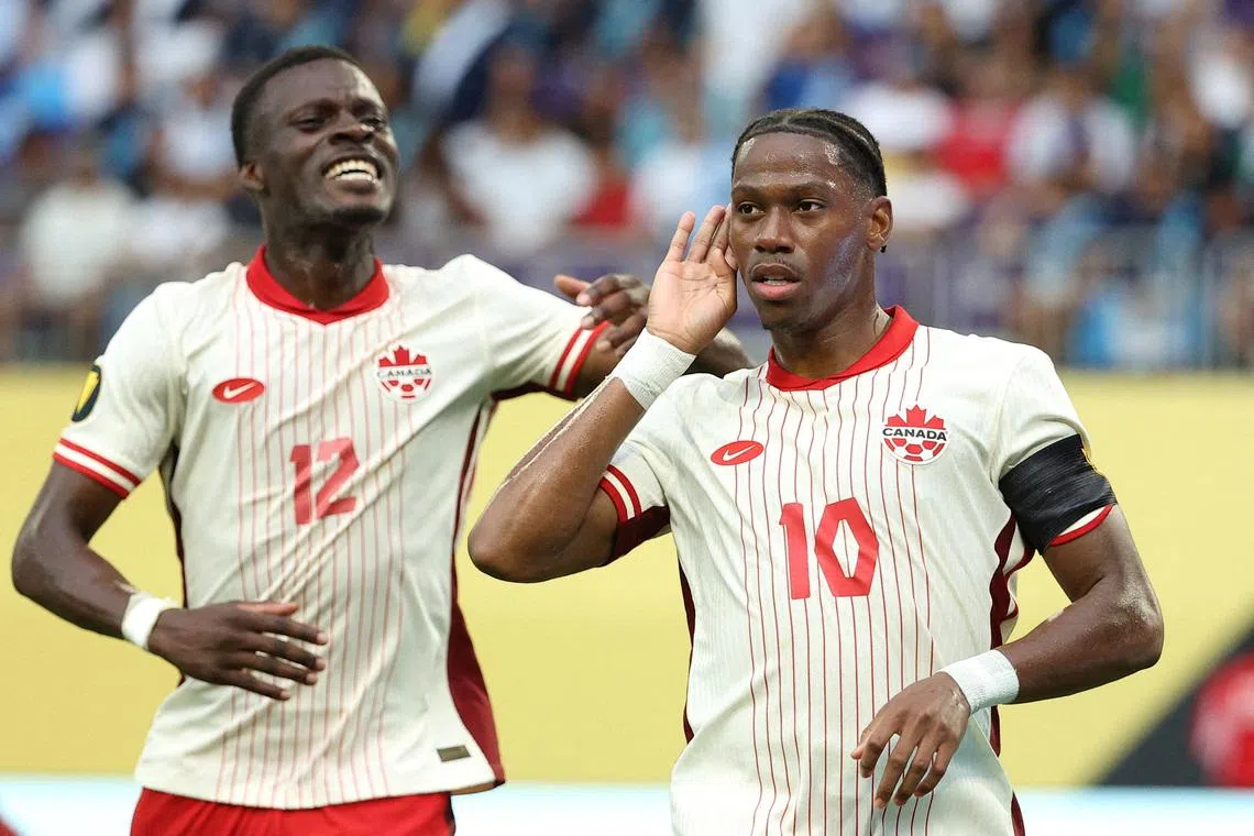FILE PHOTO: Jun 29, 2025; Minneapolis, Minnesota, USA; Canada forward Jonathan David (10) celebrates with forward Tani Oluwaseyi (12) after scoring a goal against Guatemala in the first half during a quarterfinal match of the 2025 Gold Cup at U.S. Bank Stadium. Mandatory Credit: Matt Krohn-Imagn Images/File Photo