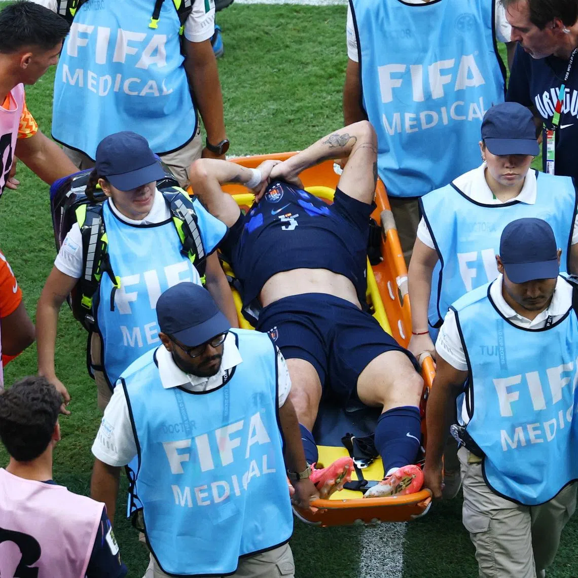Soccer Football - FIFA World Cup 2026 - Group H - Uruguay v Spain - Estadio Guadalajara, Guadalajara, Mexico - June 26, 2026 Uruguay's Manuel Ugarte looks dejected as he is stretchered off after sustaining an injury REUTERS/Raquel Cunha