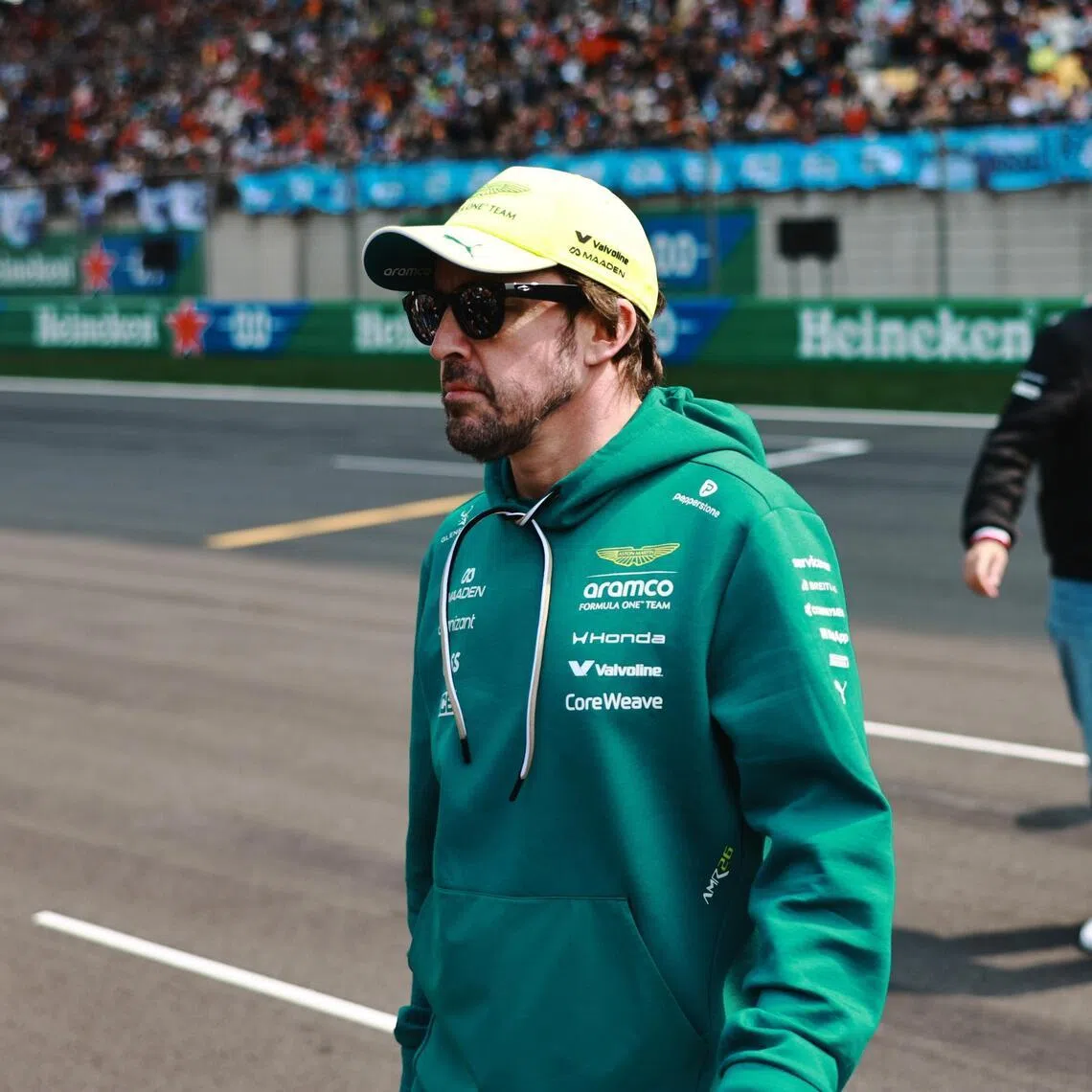 Aston Martin driver Fernando Alonso of Spain looking on during the drivers parade before the Formula One Chinese Grand Prix on March 15, 2026, at the Shanghai International Circuit racetrack.