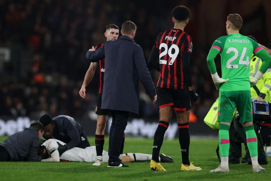 Soccer Football - Premier League - AFC Bournemouth v Luton Town - Vitality Stadium, Bournemouth, Britain - December 16, 2023 Luton Town's Luton Town's Tom Lockyer receives medical attention Action Images via Reuters/Paul Childs