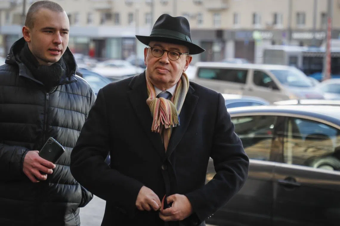 French Ambassador to Russia Pierre Levy (centre) arrives at the main building of the Russian Foreign Ministry in Moscow.