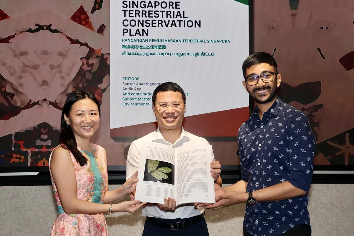 National Development Minister Desmond Lee (centre) with primatologist Andie Ang (left) and Herpetological Society of Singapore co-founder Sankar Ananthanarayanan.