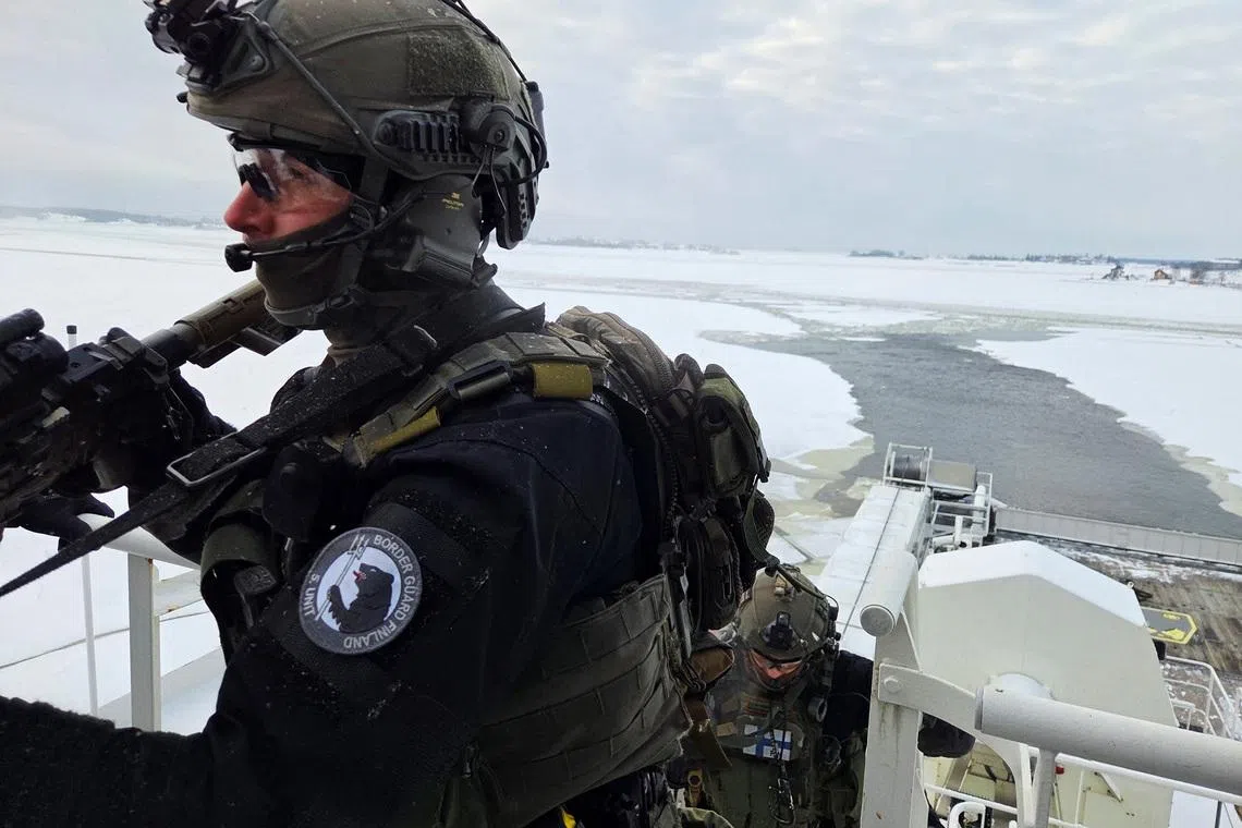 A member of the Finnish Border Guard's Special Intervention Unit takes part in an exercise on an offshore patrol vessel, Turva, near Helsinki on the Baltic Sea, Finland, January 26, 2026. Picture taken with a mobile phone. REUTERS/Anne Kauranen