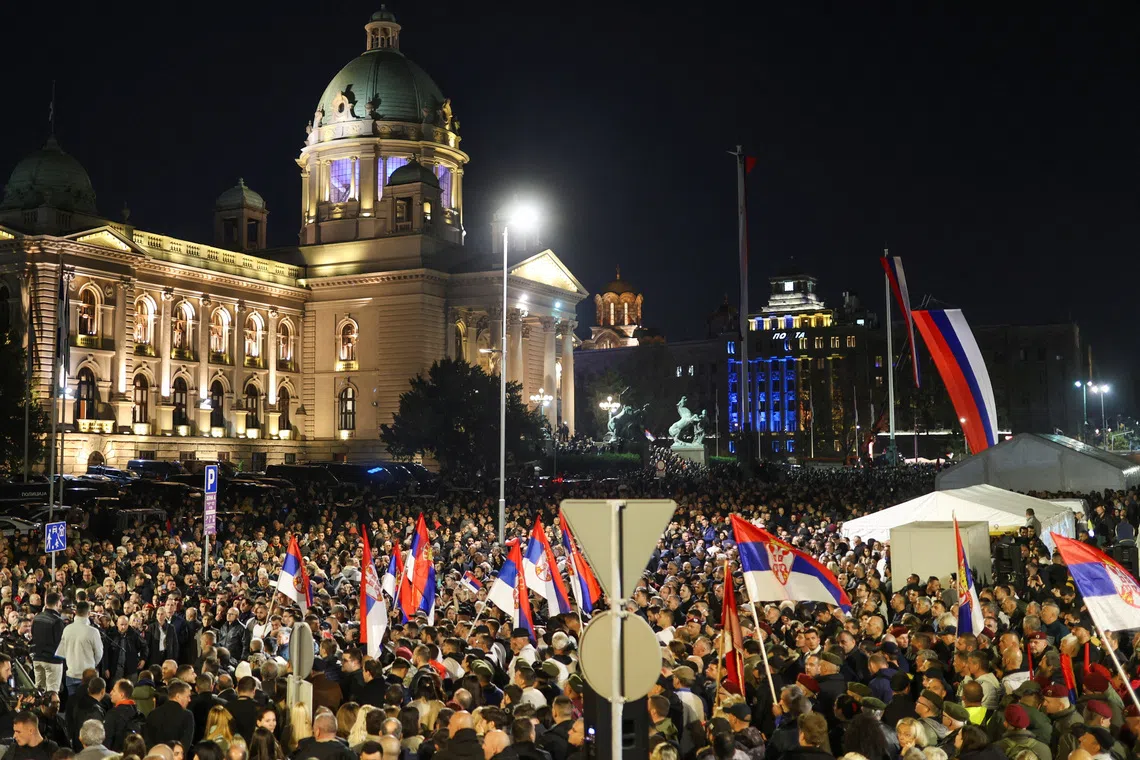 Supporters of Serbian President Aleksandar Vucic take part in a demonstration near the tents where student protesters are staying with the mother of one of the victims of the fatal November 2024 railway station canopy collapse, who is on a hunger strike, in Belgrade, Serbia, November 5, 2025. REUTERS/Djordje Kojadinovic